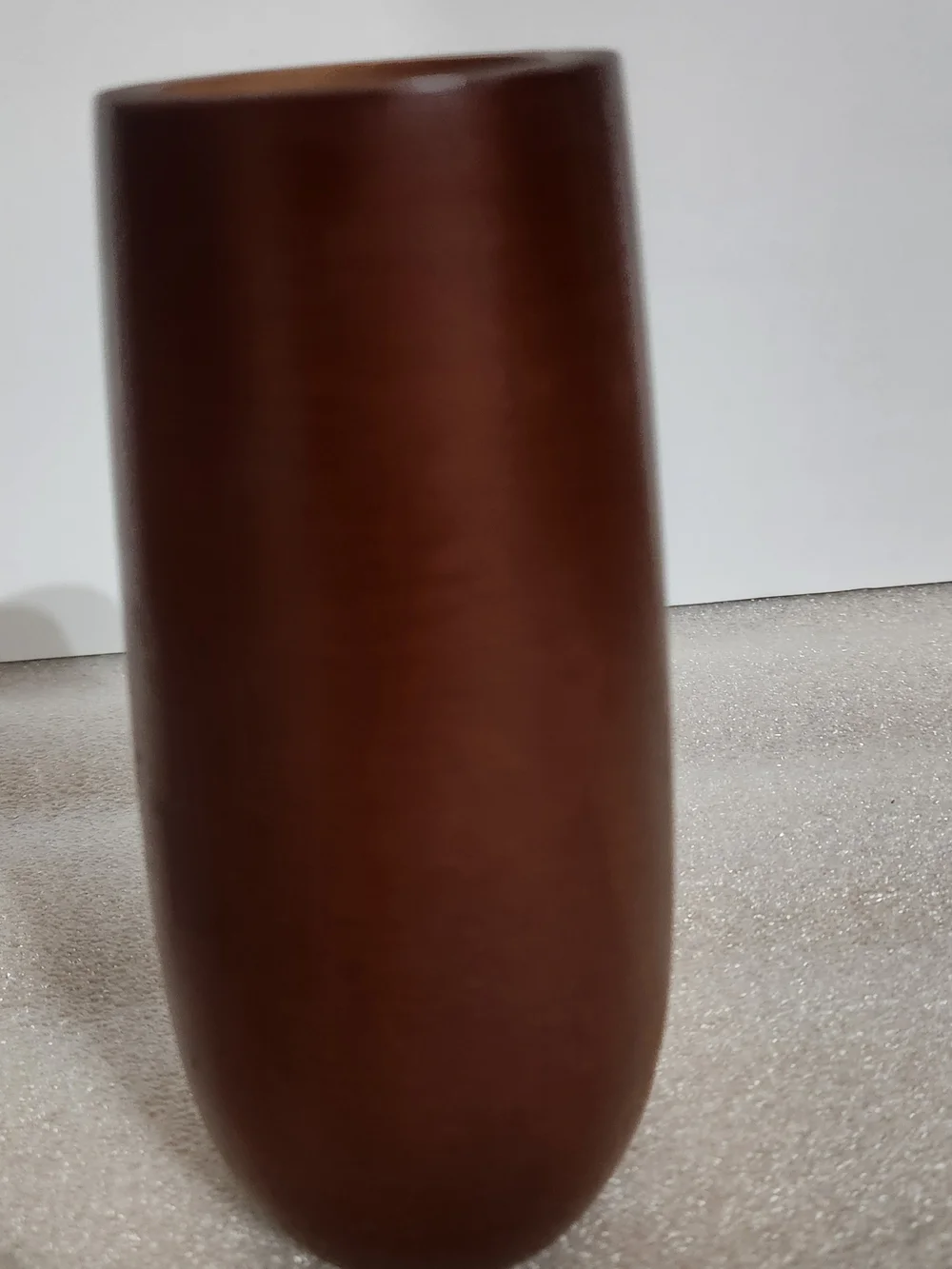 Vintage, mid-century modern style candle holder is crafted from turned wood with